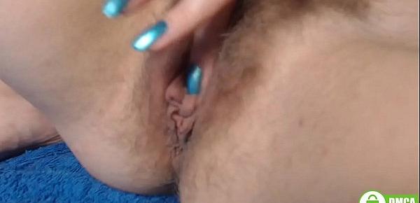  Blue manicured fingers rubbing big clit. Hairy redhead pussy close up
